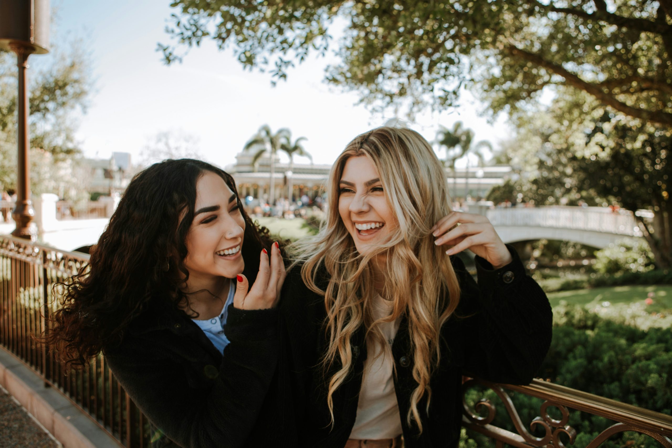 Women laughing together because of emotional intelligence